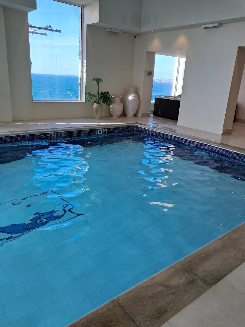 Swimming pool with sea views.