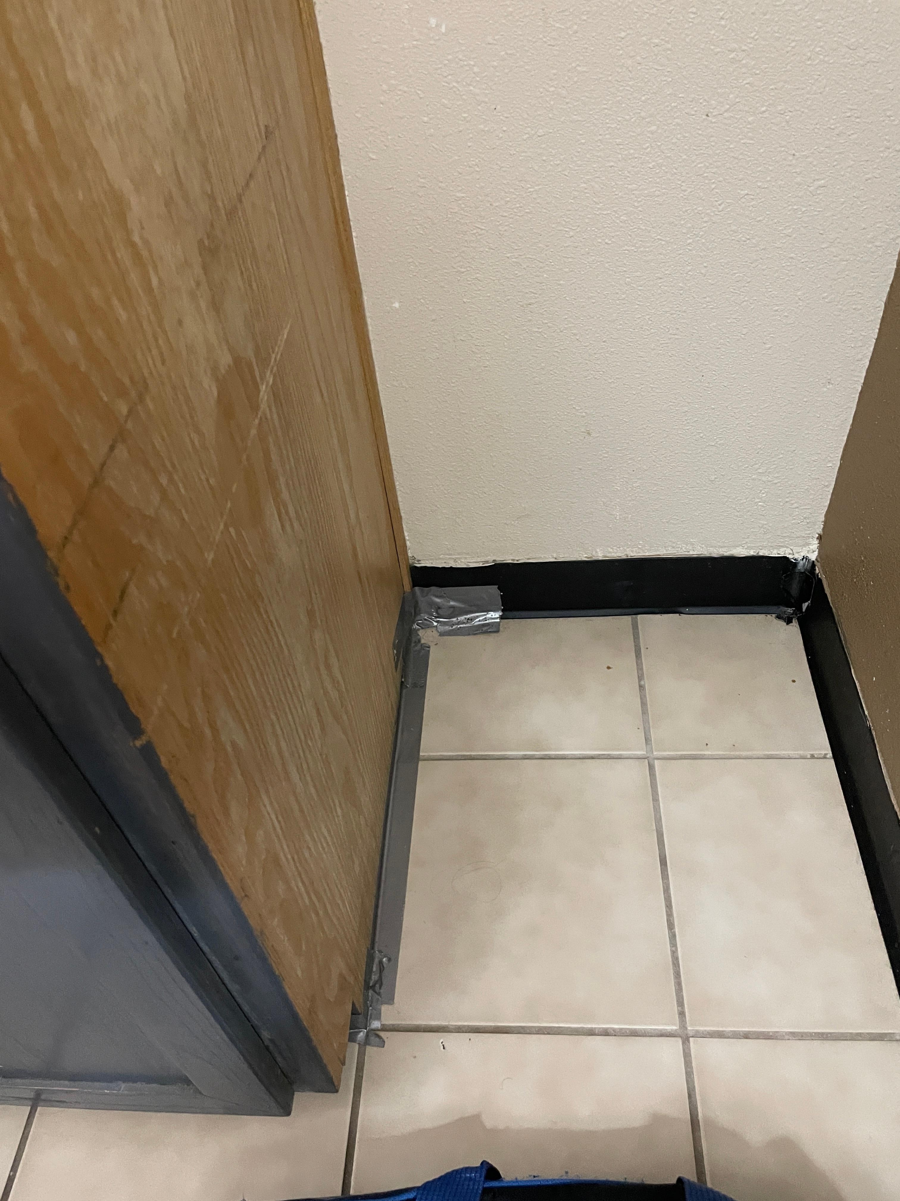 There was grey tape around the room. Maybe it was their caulking?