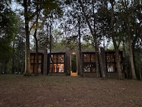 Building 300 from the walking path by the river