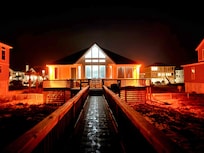 Nighttime view of back deck from beacb
