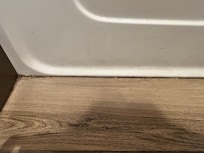 Corner of floor and side of tub