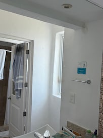 Mirrors had black spots. Windows looking into both bathroom and in front of sink are visible from outside and have no blinds.