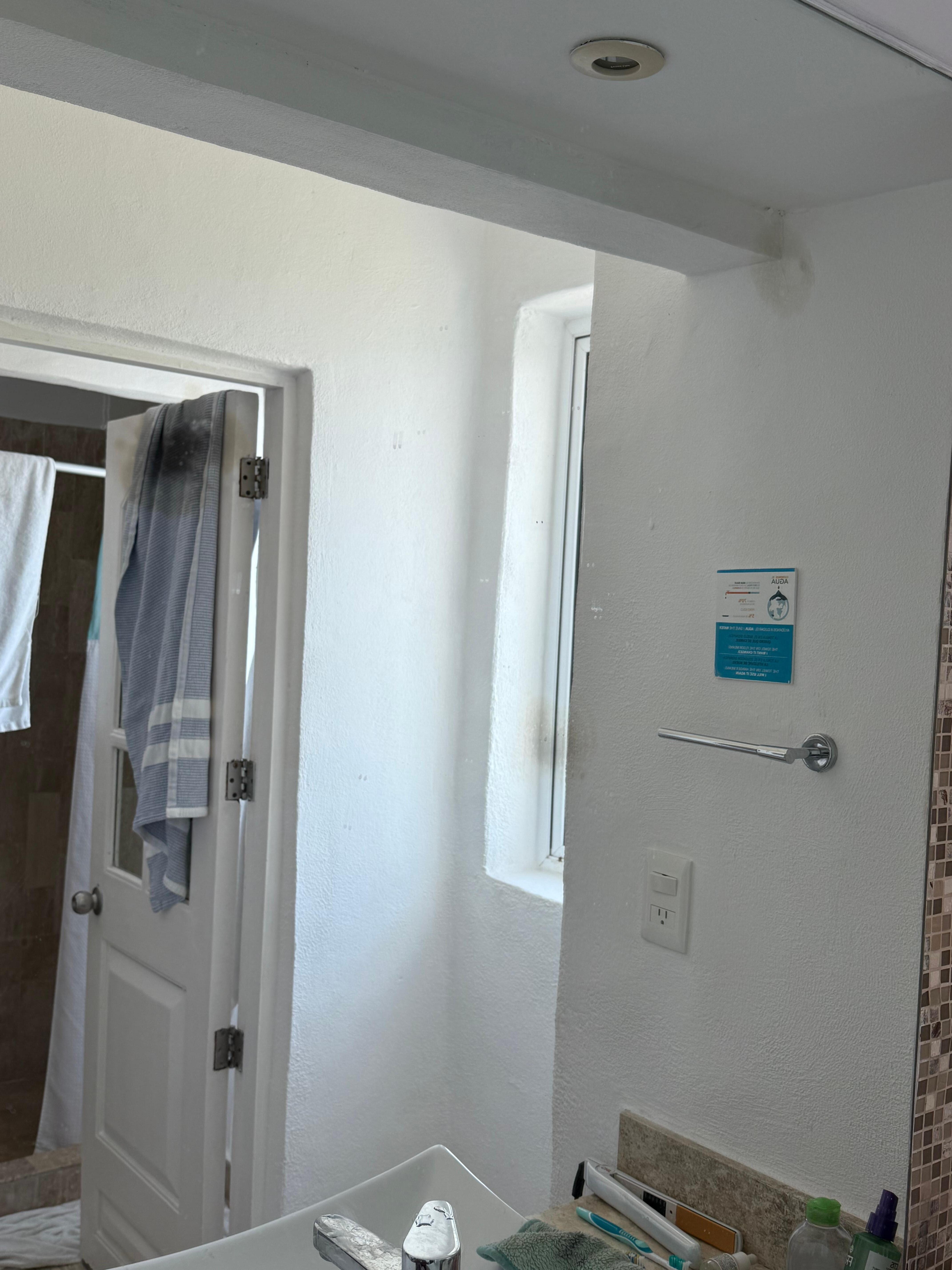 Mirrors had black spots. Windows looking into both bathroom and in front of sink are visible from outside and have no blinds.