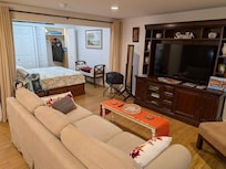 Living area with partial bedroom view