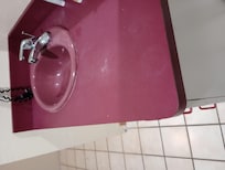 Dirty old sink and counter.