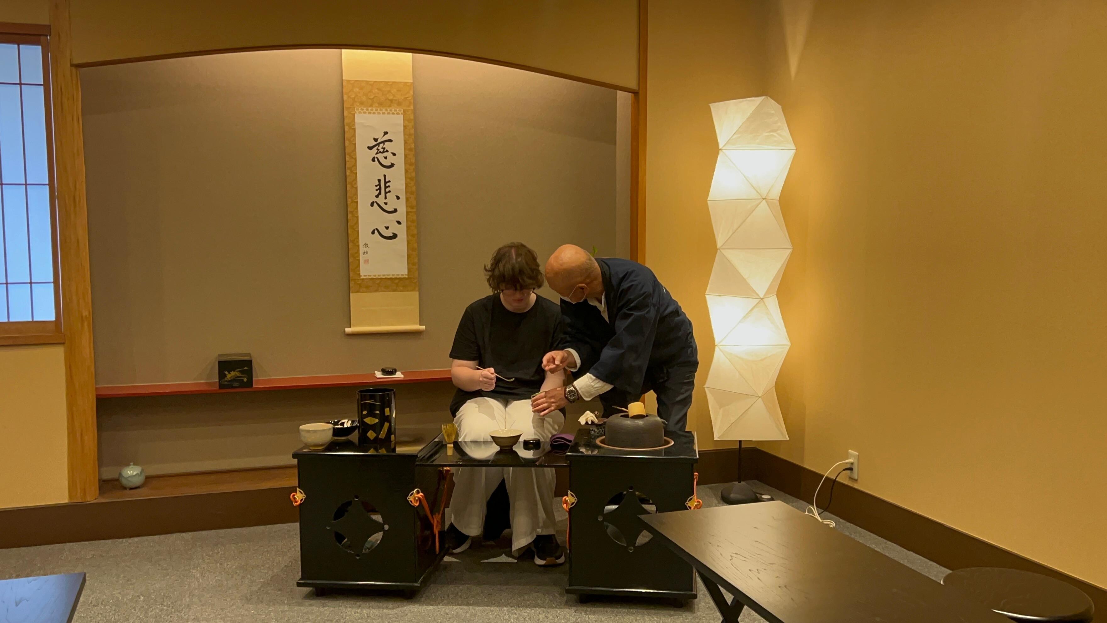 My daughter trying her hand at the tea ceremony