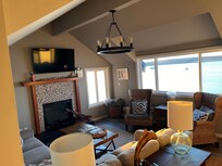 Living room with electric fireplace. Lots of games & very cozy