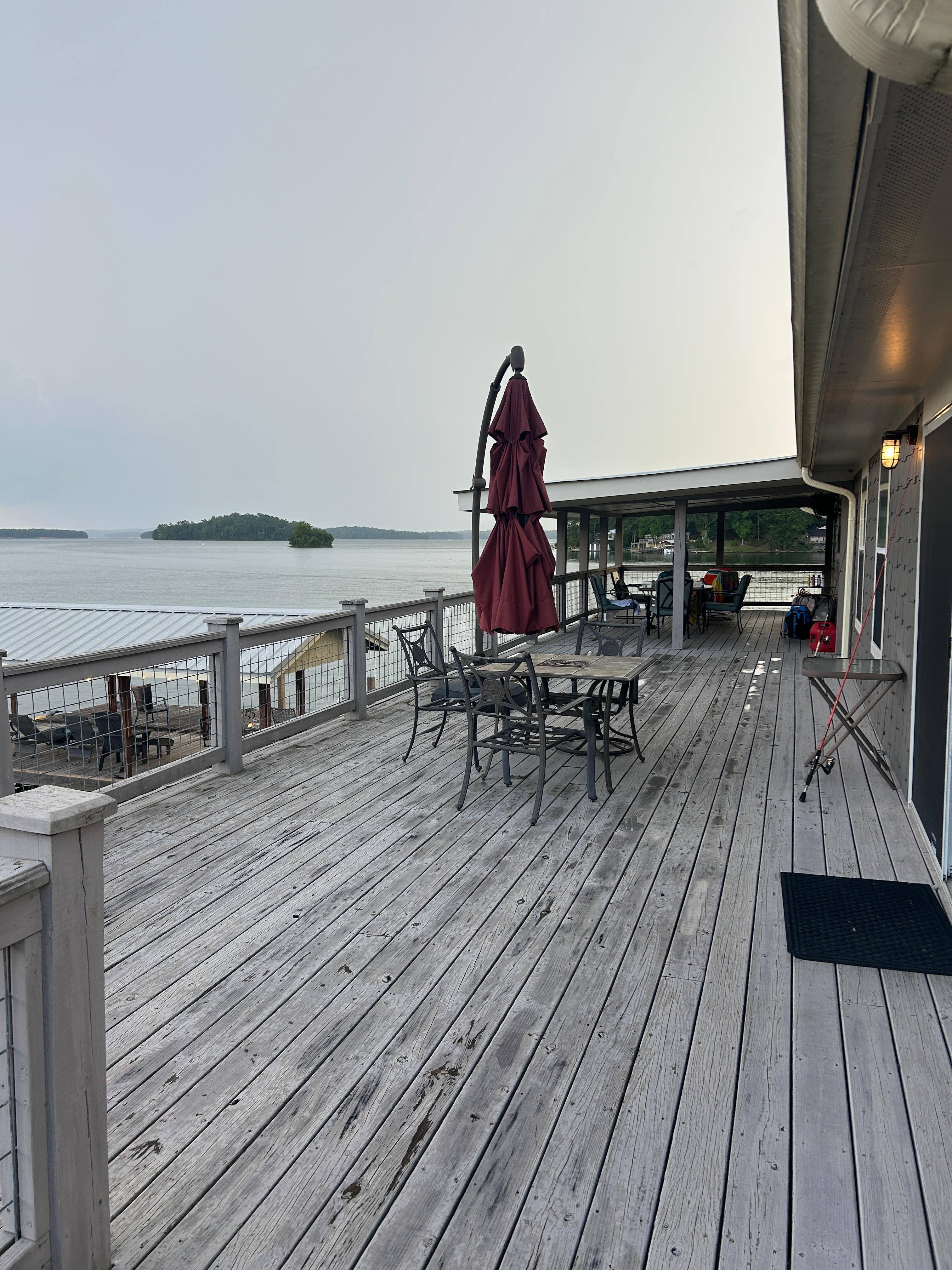 Porch/lake standing near driveway 