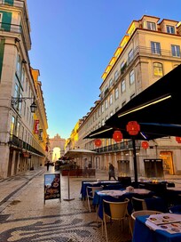Vibrant Rua Augusta right outside the hotel — lined with restaurants, cafés, and shops, full of life both day and night in the heart of Lisbon.