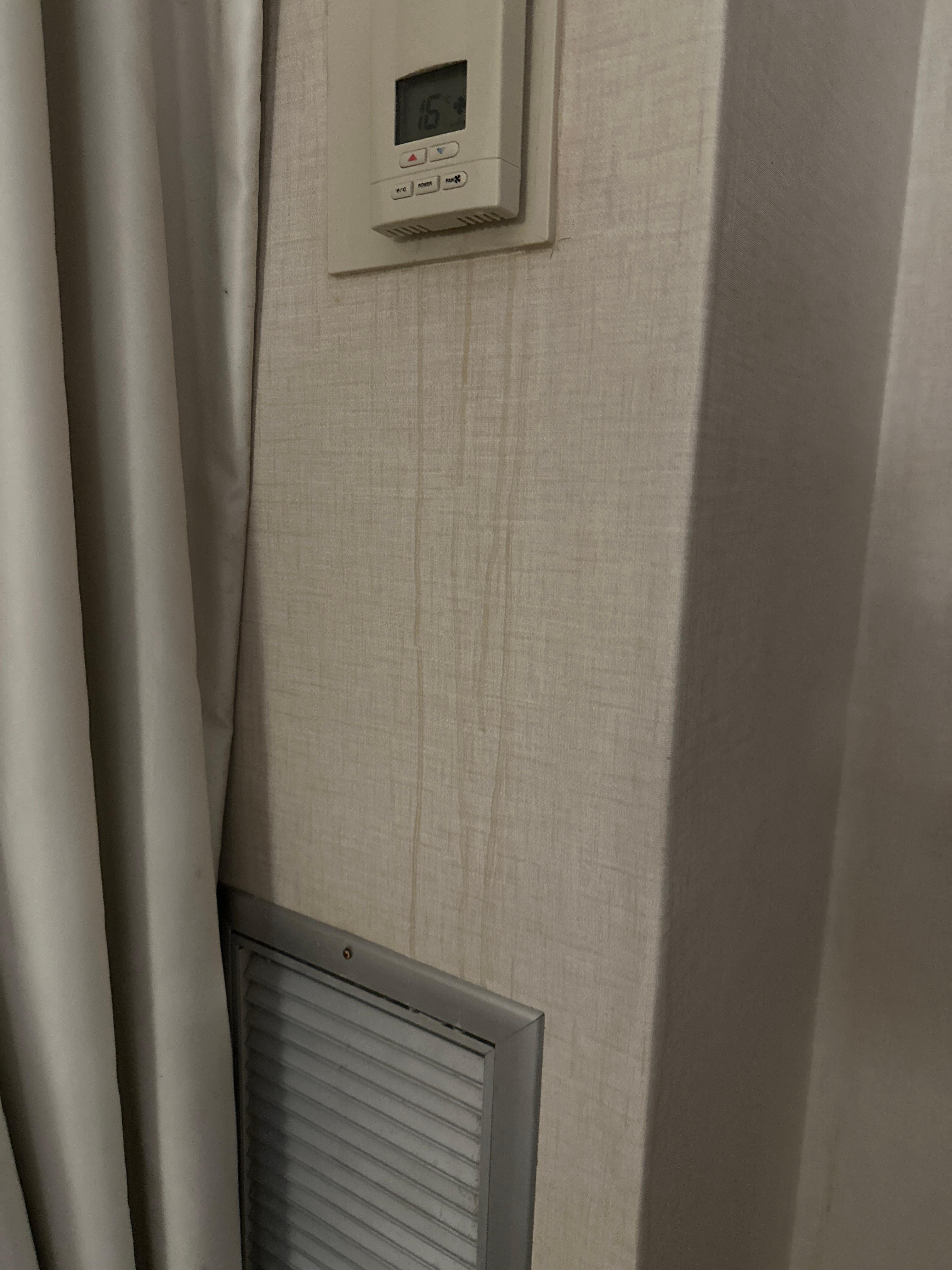 Stains on wall under thermostat