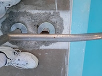 Broken pool handrail that could injure or potentially kill a child or adult.