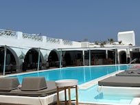 Main pool area with restaurant to the left and pool bar to the right