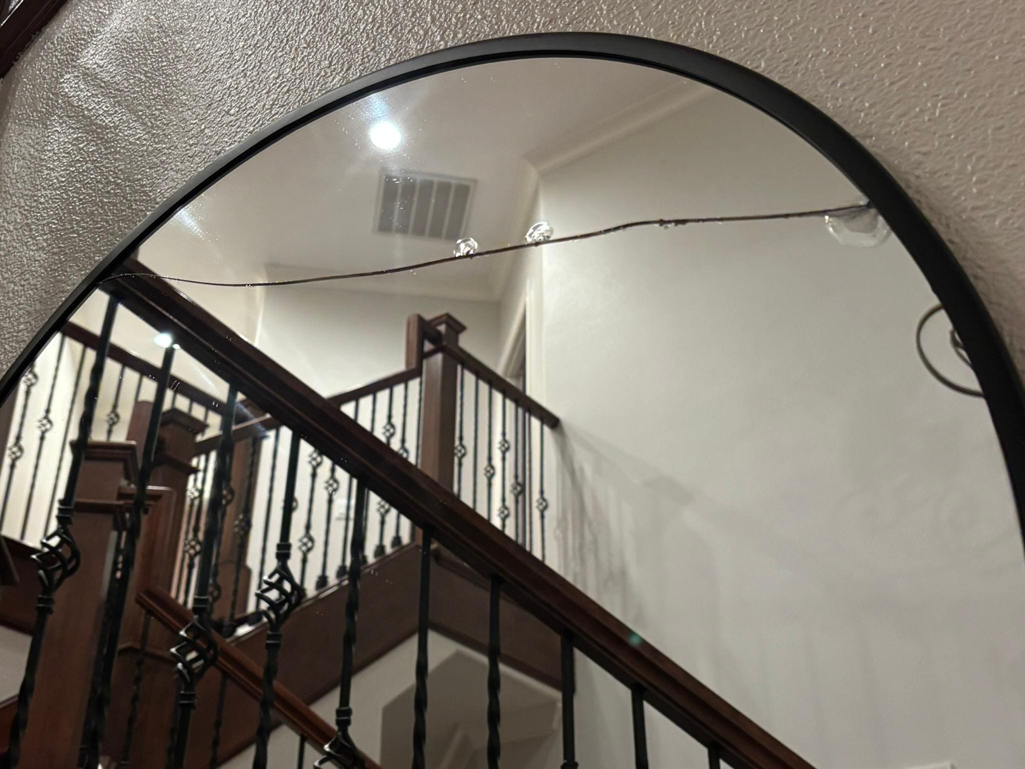 Broken Mirror in entry way 