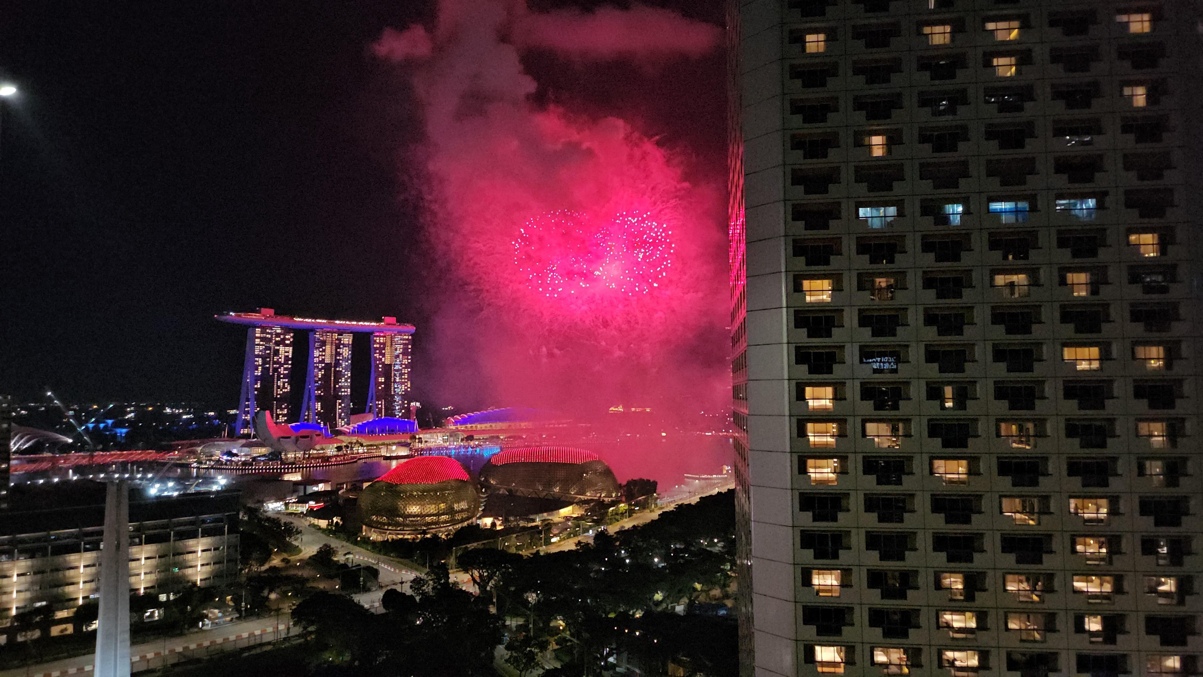 Evening view with a fireworks show over the bay.