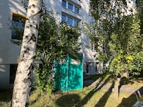 The portable toilet right outside the rooms.