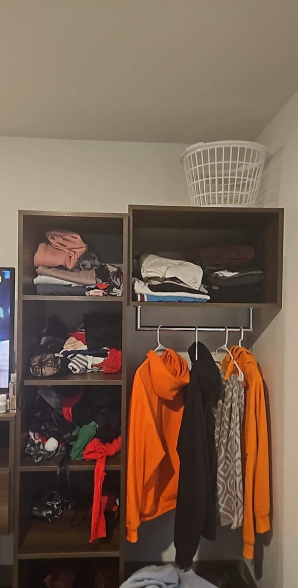 I had a huge suitcase forr and my bf and it fit everything there's a desk and a TV right next to this 