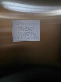 Sign on elevator door.
