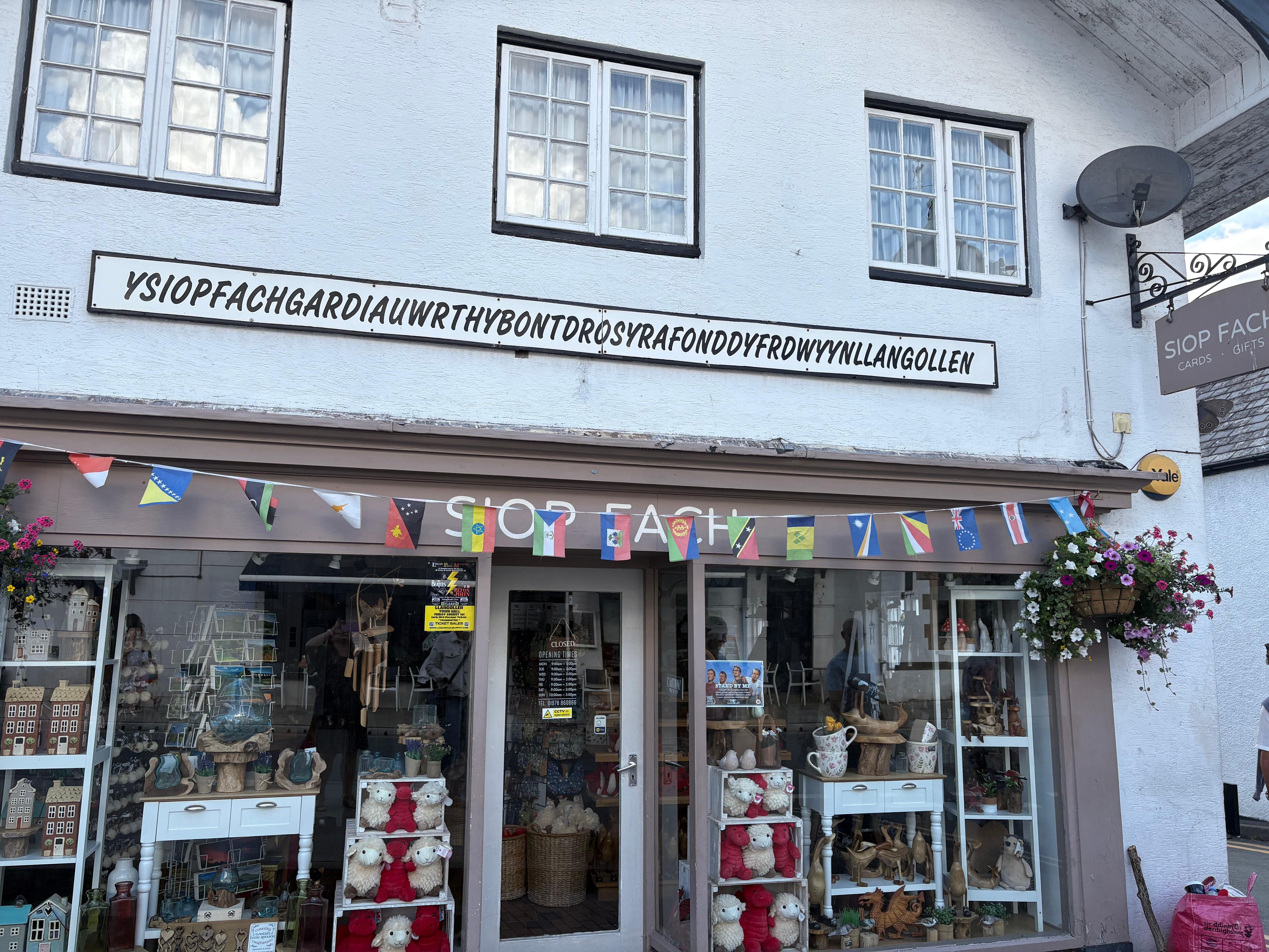 This a a small shop with a garden by a bridge in Llangollen. That’s what the signs says in Welsh ( I think) 