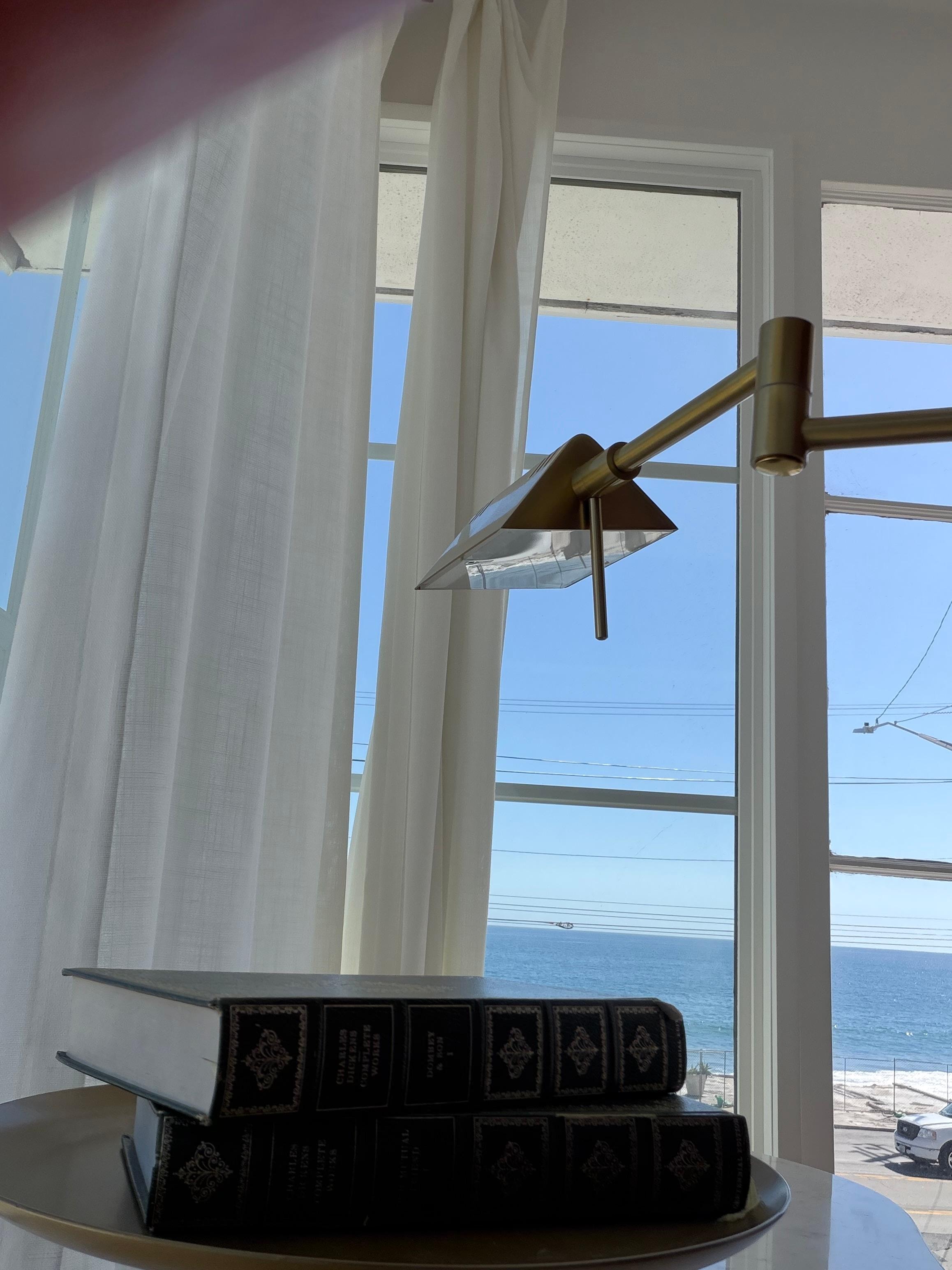 An office brief a desk and ocean view