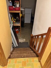 House open to garage noises, smells, and cold air.