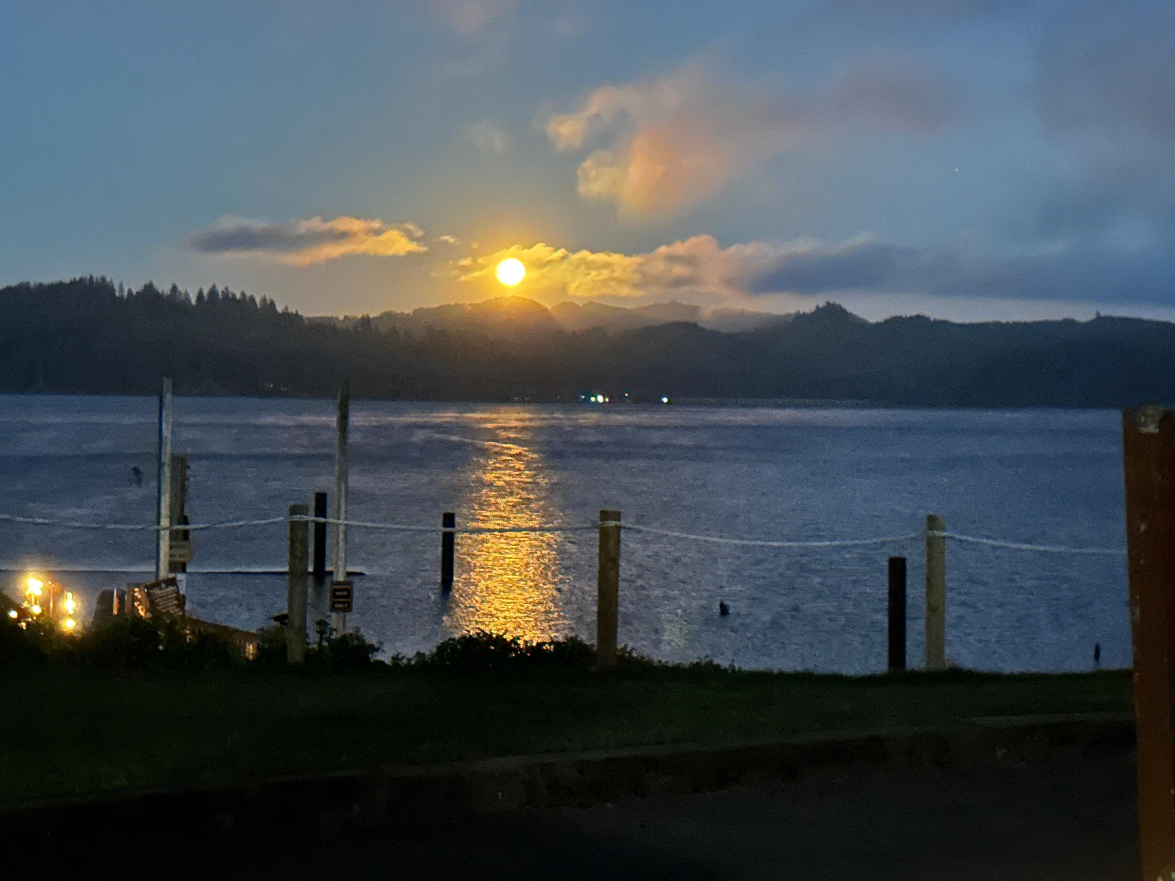 Looks like a sunset but is a rising moon over the lake. 