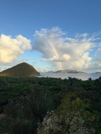 Morning coffee on the deck with a beautiful rainbow