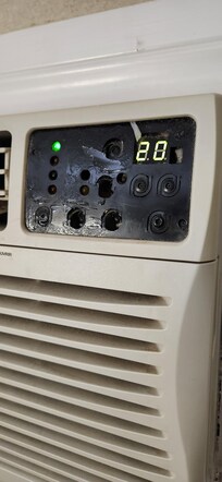 All the buttons were pulled off the AC unit. Good luck on adjusting the temperature.