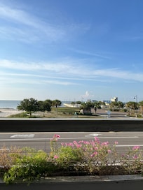 Sitting outside drinking coffee at the coffee shop across from the hotel.