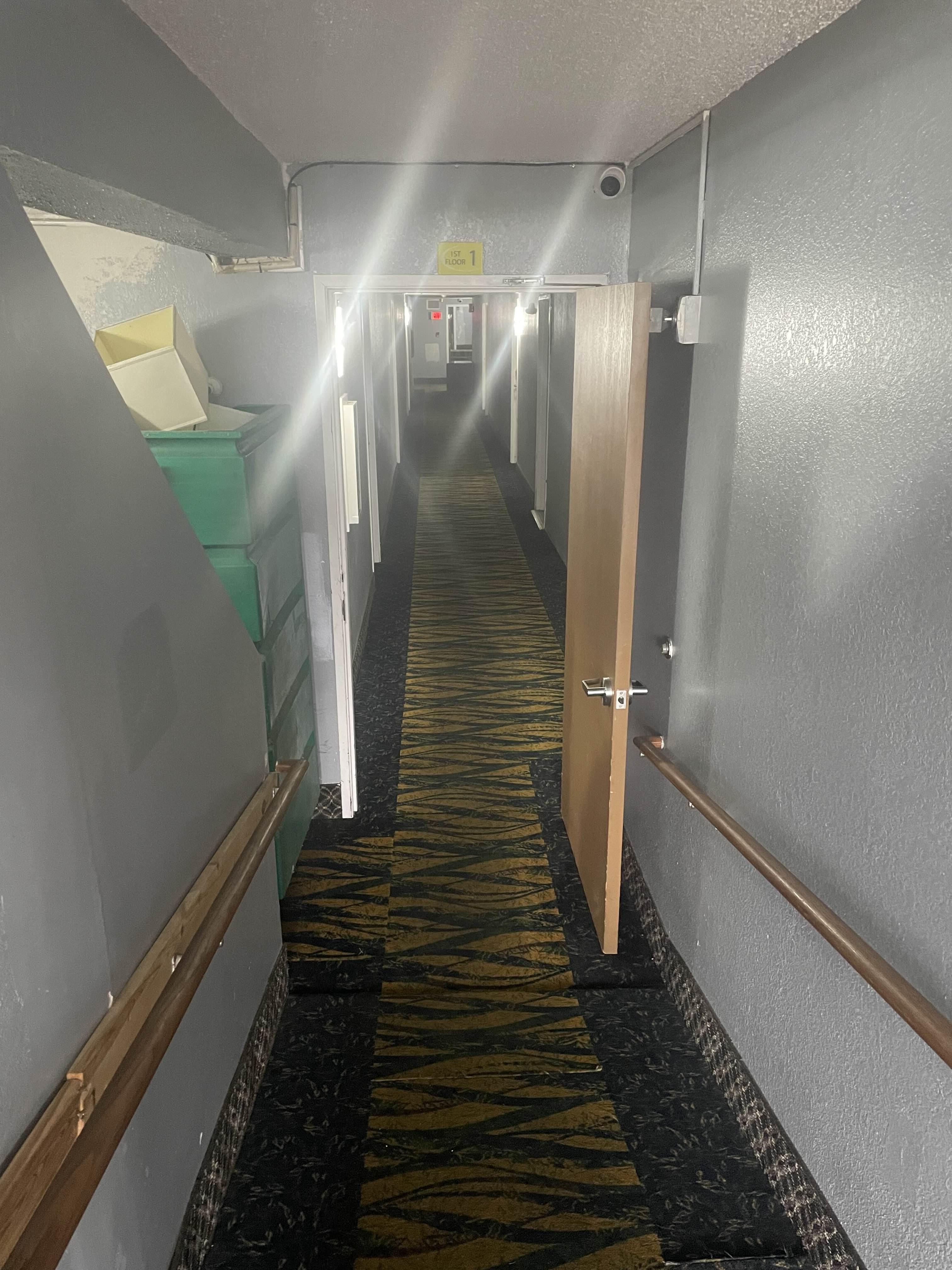 Hallway leading to room. Dark; dirty; weird smell.