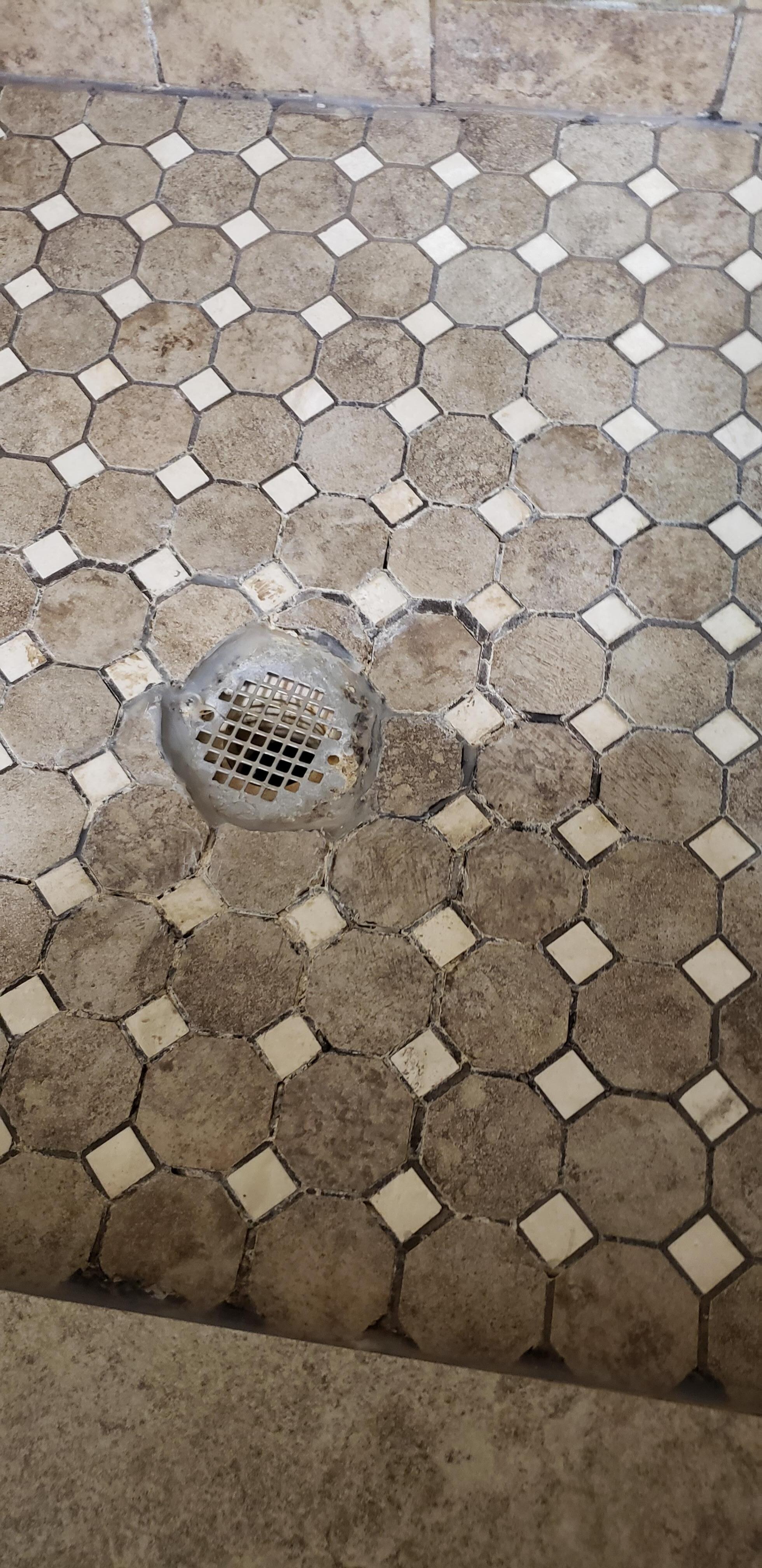 shower getting very worn and needing regrout