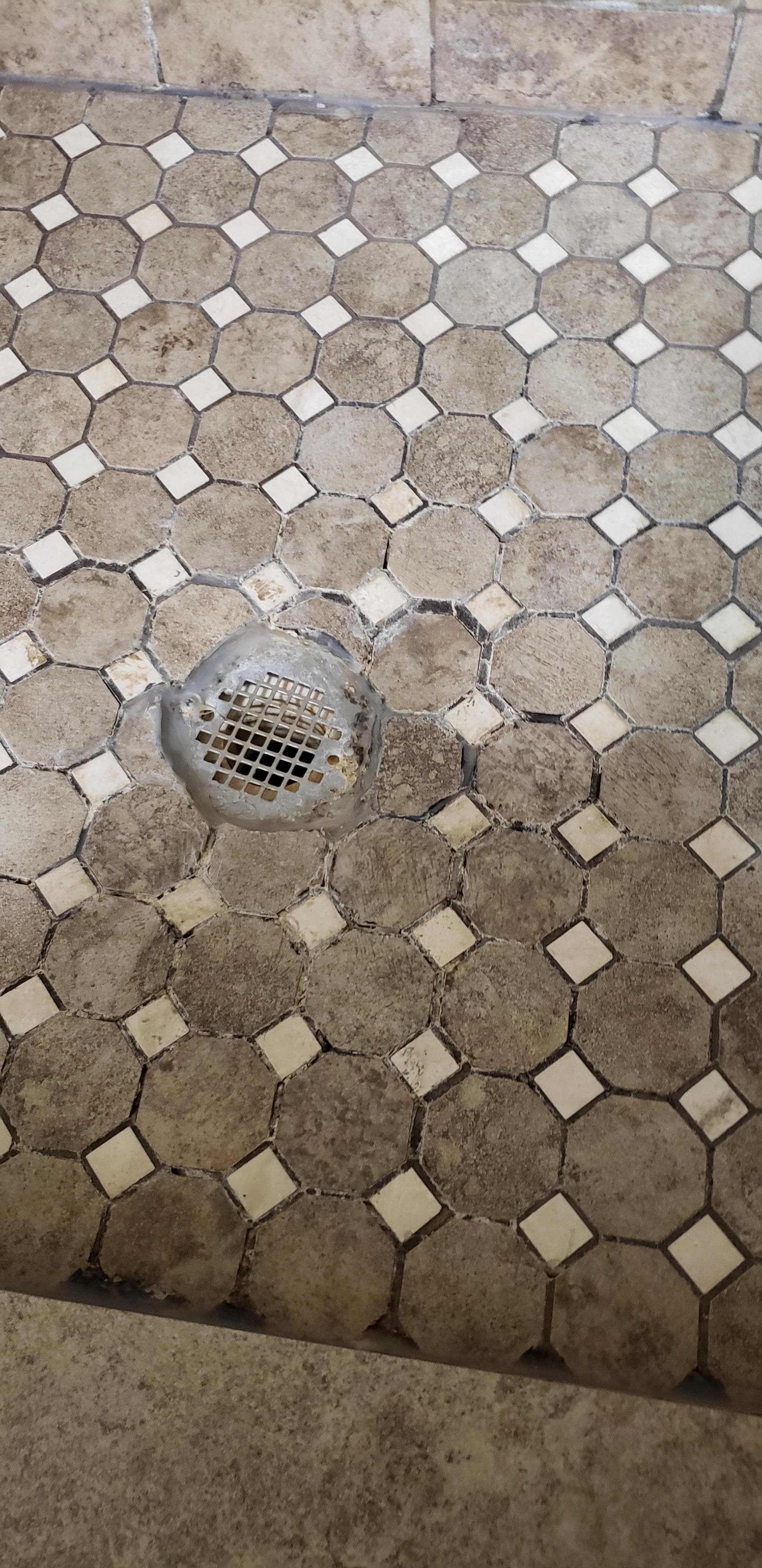 shower getting very worn and needing regrout
