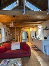 Main living area ,kitchen with loft bedroom