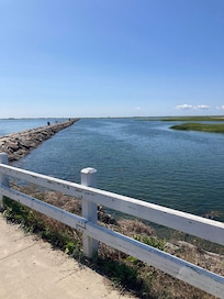 Provincetown Jetty (about 0.6 miles). You can safely swim on marsh side. 8'-9' tides here.