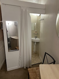 shower room with very small corner sink in interior BR