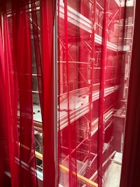 Scaffloding just outside of the only window of the room (inside of the room is directly visible)