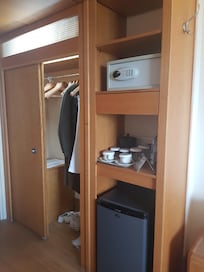 Safe/locker, fridge had water bottles free of charge. Iron and ironing board in the closet including hangers for clothes and shoe storage
