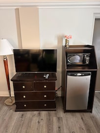 Tv, microwave and fridge