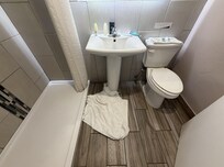 Nice Bathroom, large shower no tub, Great water pressure and Hot Water. You need to come in, close the door then sit down, if you want privacy.