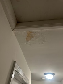 peeling paint upstairs hallway from prior leak?