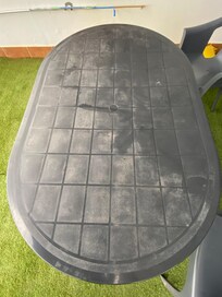 Stained plastic table which dips in
the middle