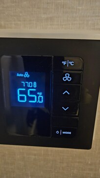 The AC was set at 65 but the room temp was 77+