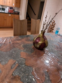 Amazing dining room table detail and view toward kitchen