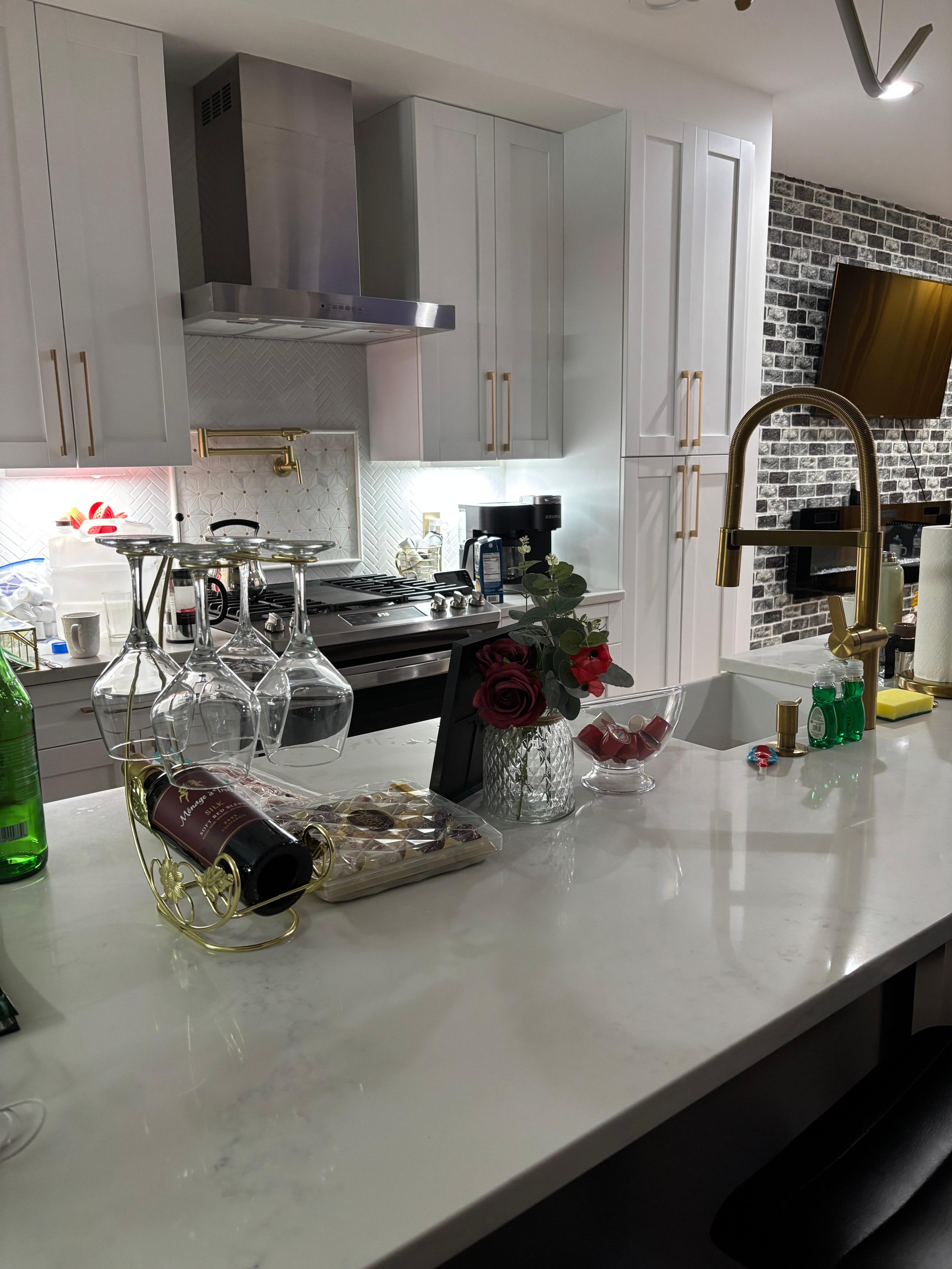 Kitchen that was fully stocked with bar stool for additional seating. 
