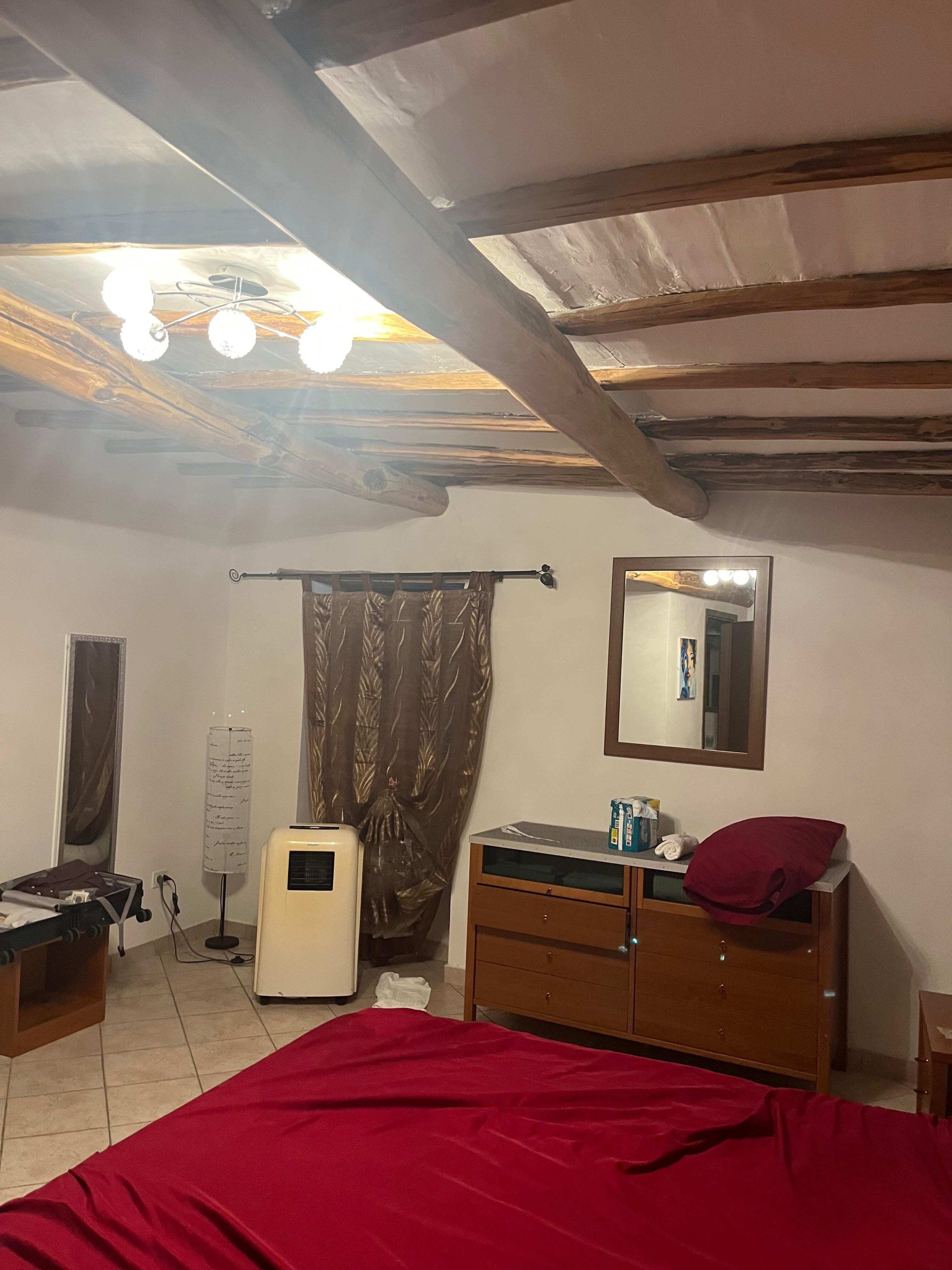 The upstairs bedroom with its air coonditioning unit