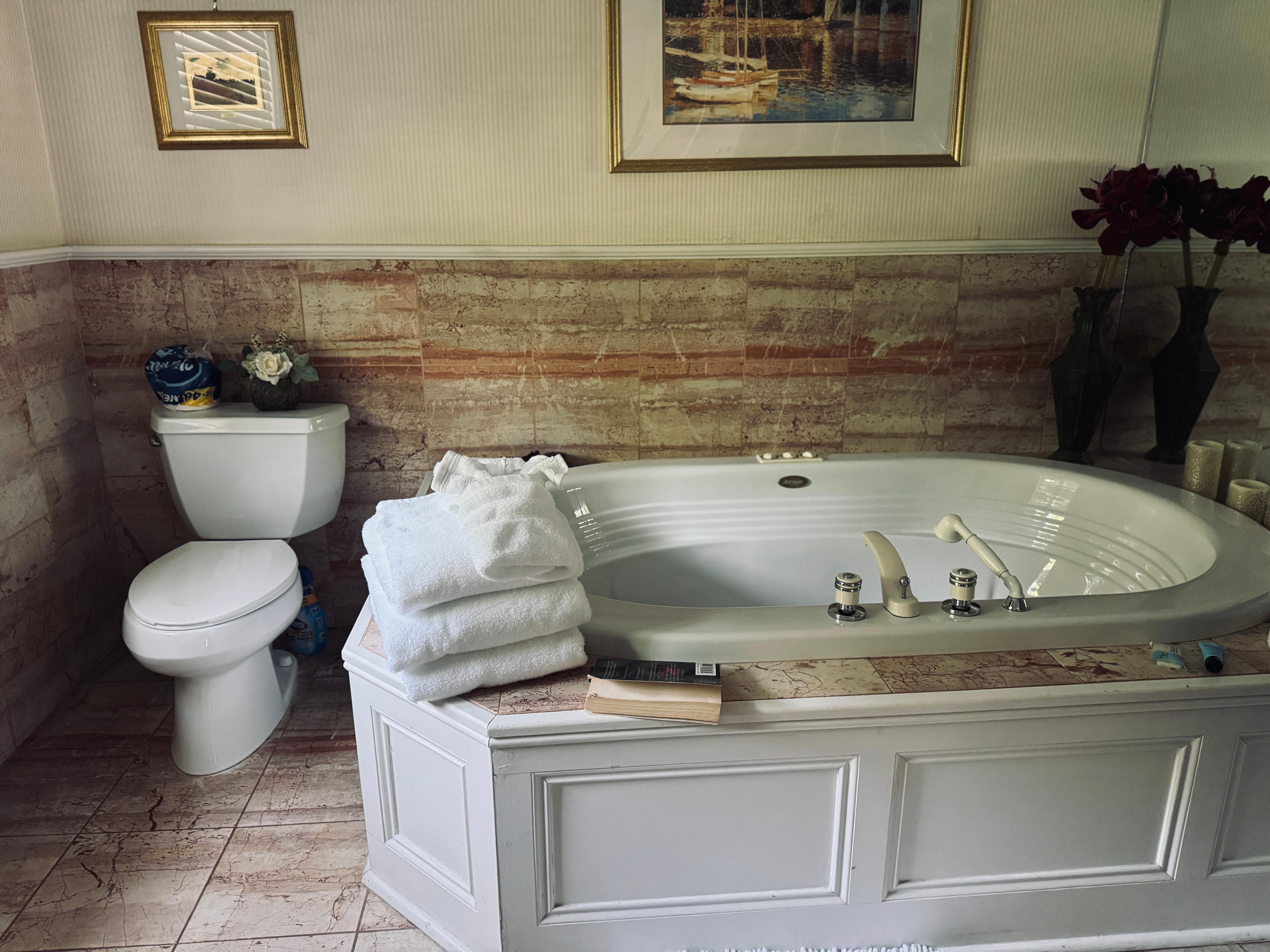Beautifully tiled bathroom and tub in the "Yellow Room"