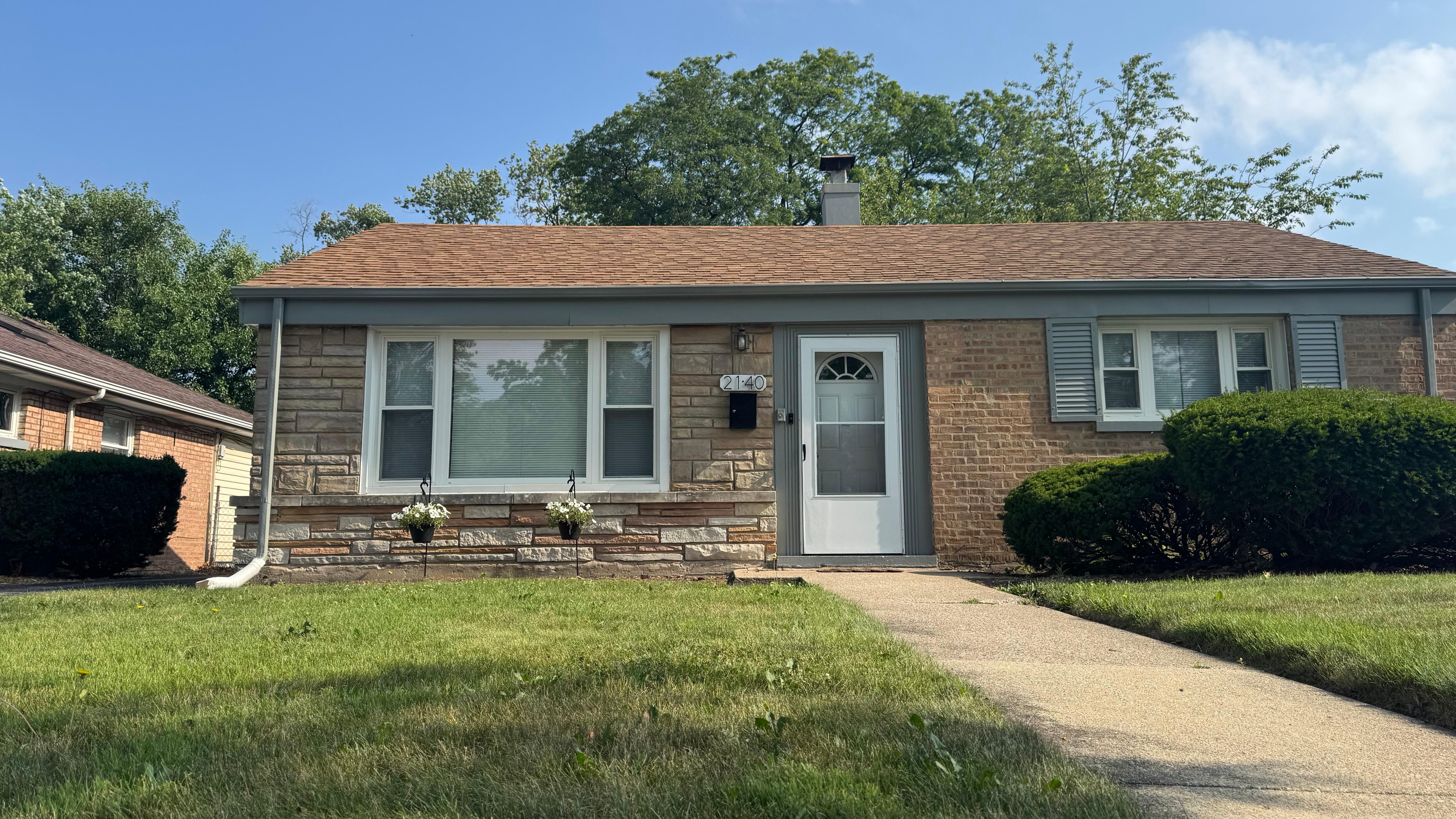 Front of house - neat and well trimmed lawn
