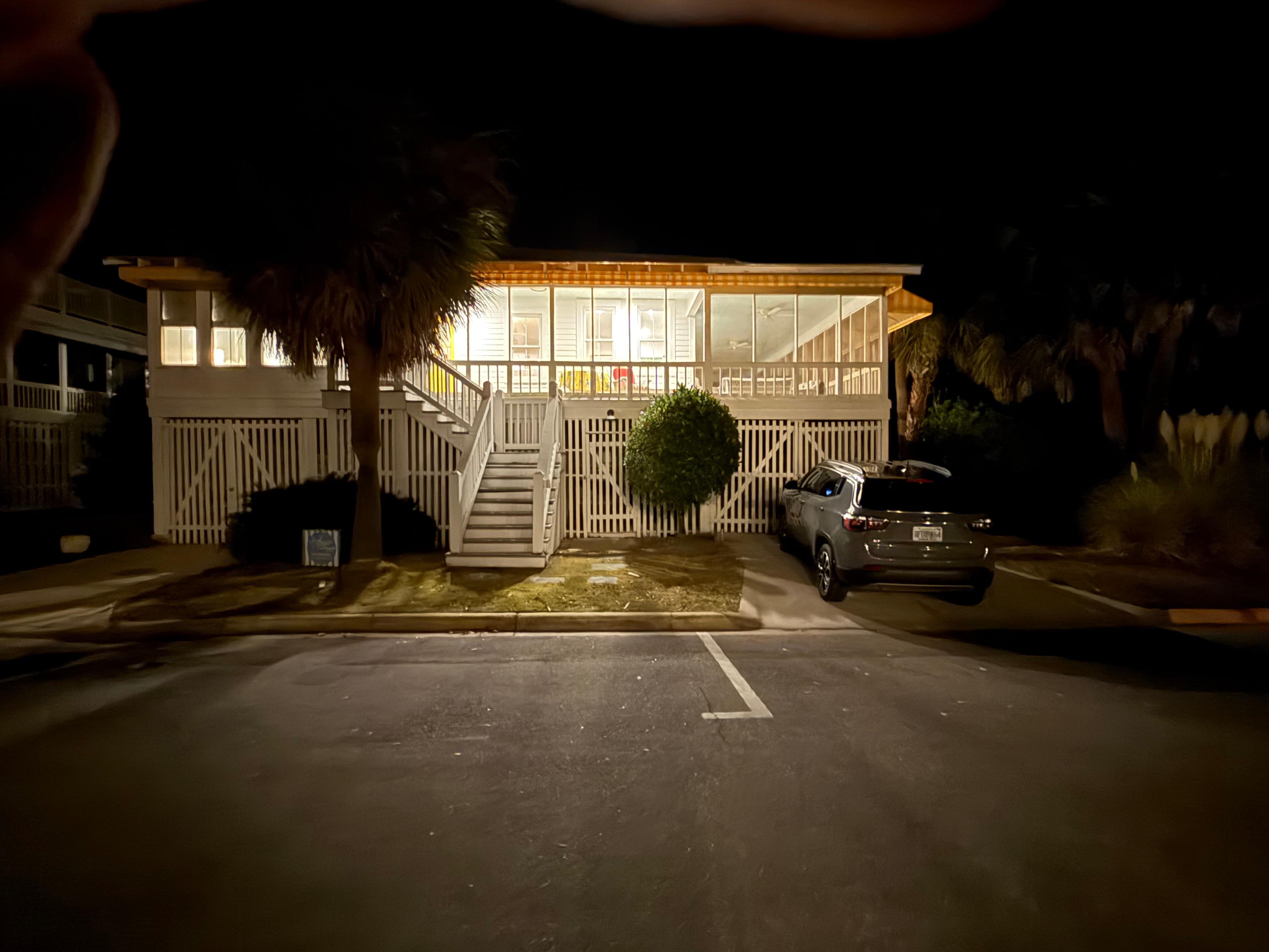 Home at night from the street. 