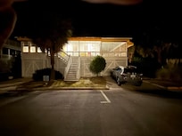 Home at night from the street.