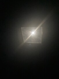 Skylight with a view of the moon at night