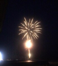 Views from the balcony of fireworks on the beach.